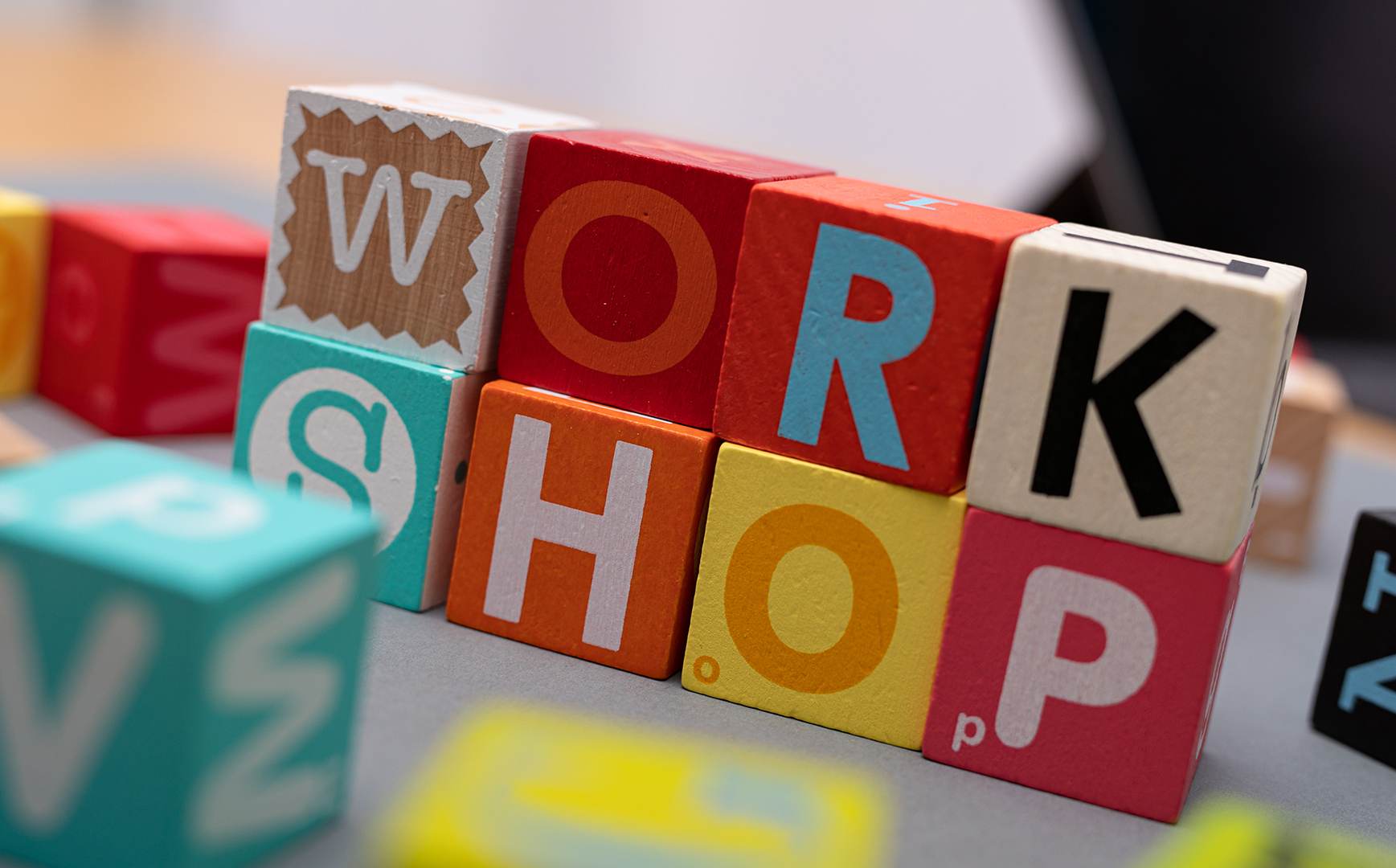 Remarkable People wood blocks with the word workshop